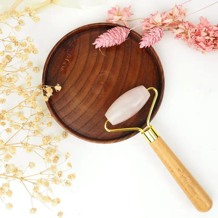 Pink quartz facial roller with Gua Sha