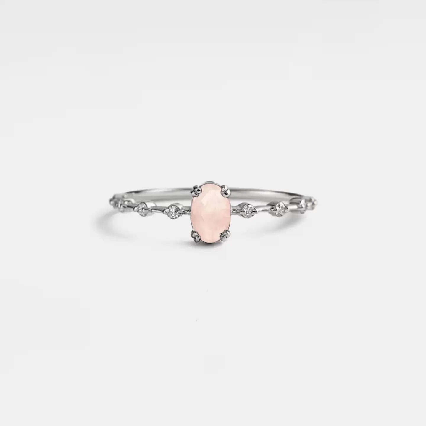 Natural oval rose quartz ring