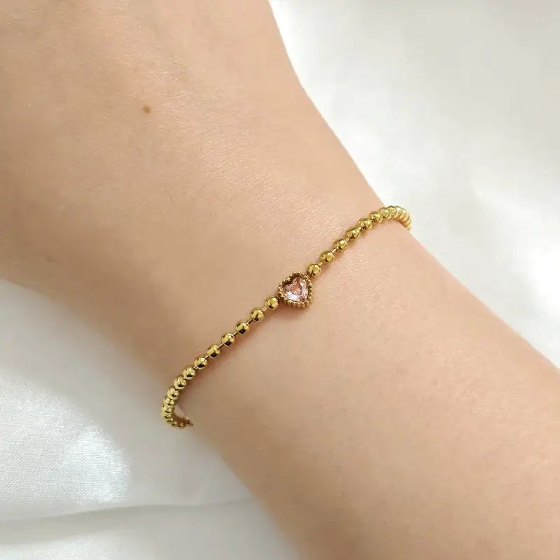 Perlenarmband mit rosa Herz